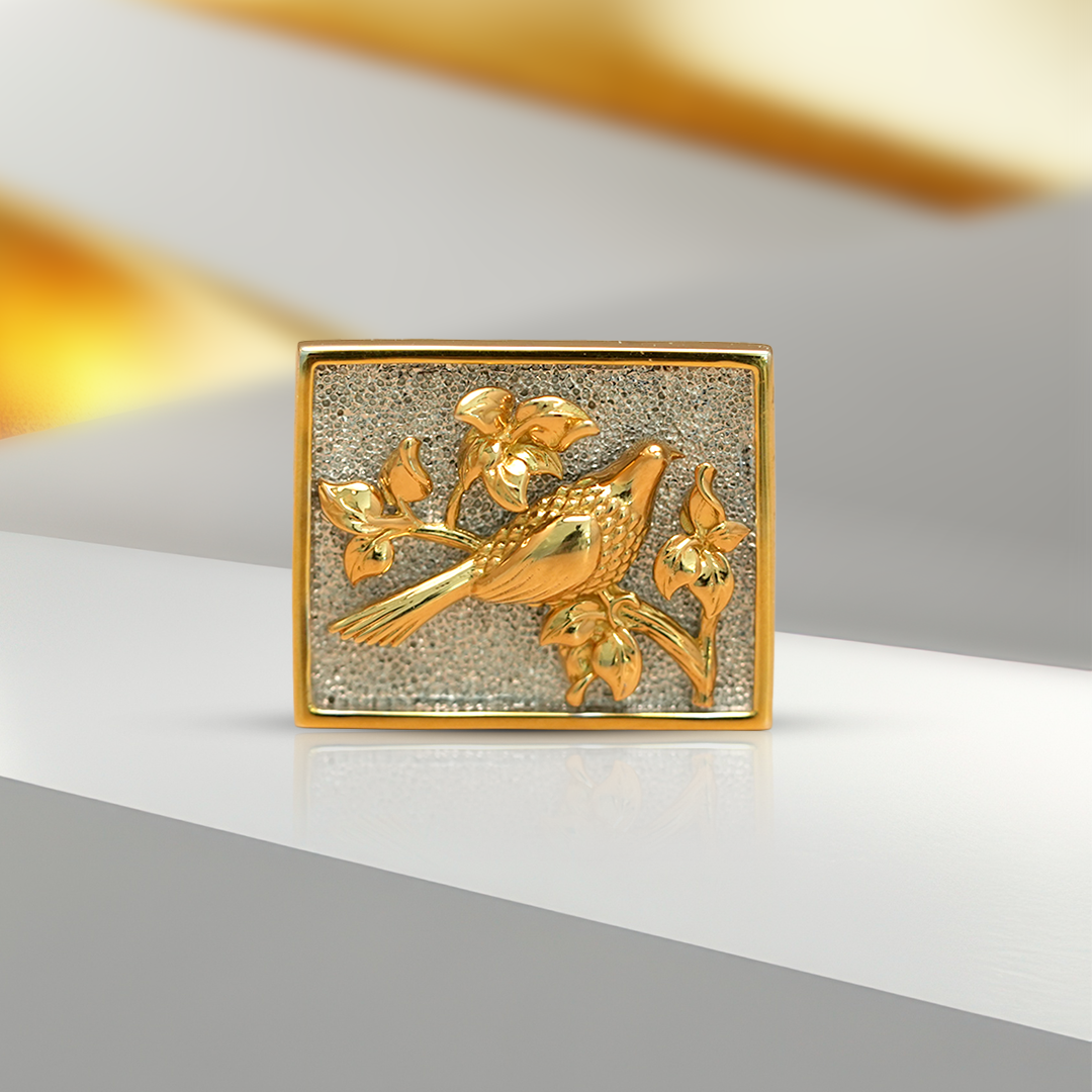 Gold bird brooch